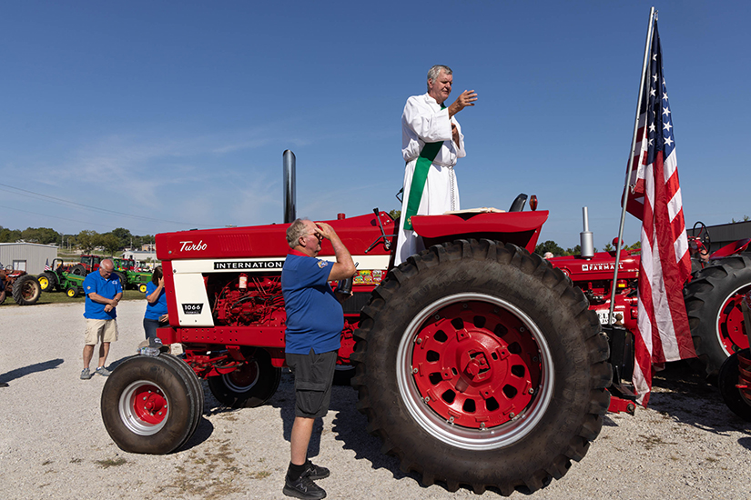 Deacon Randy Maune offered a blessing before the Knights of Columbus Journey For Charity Tractor Cruise in St. Clair on Sept. 10. One hundred and eighty-three tractors participated in the event this year, with nearly 9,000 pounds of food and more than $39,000 collected for area food pantries.