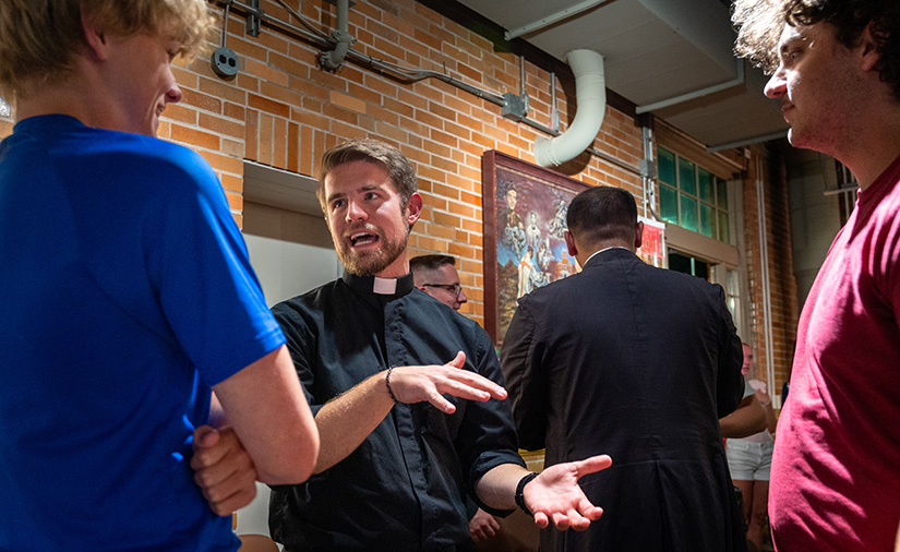 Deacon Jeffrey Fennewald, center, talked with participants during an ice cream social at Altar Call, a vocations event hosted by the archdiocesan Office of Vocations July 20 at Kenrick–Glennon Seminary. Participants gathered to discuss vocations, pray and socialize.