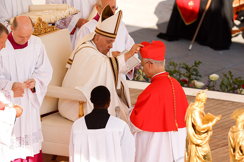 Pope Francis gave the red biretta to new Cardinal Robert F. Prevost, the U.S.-born prefect of the Dicastery for Bishops, during a consistory for the creation of 21 new cardinals in St. Peter’s Square at the Vatican Sept. 30.
