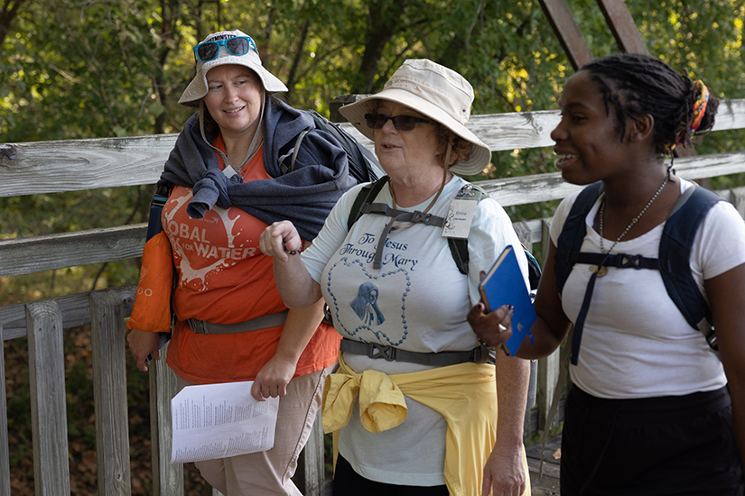 Hannah Kline, Erica Herman and Brandee Haskell talked while on the Katy Trial Marian Pilgrimage on Oct. 11 along the Katy Trail in Warren County.