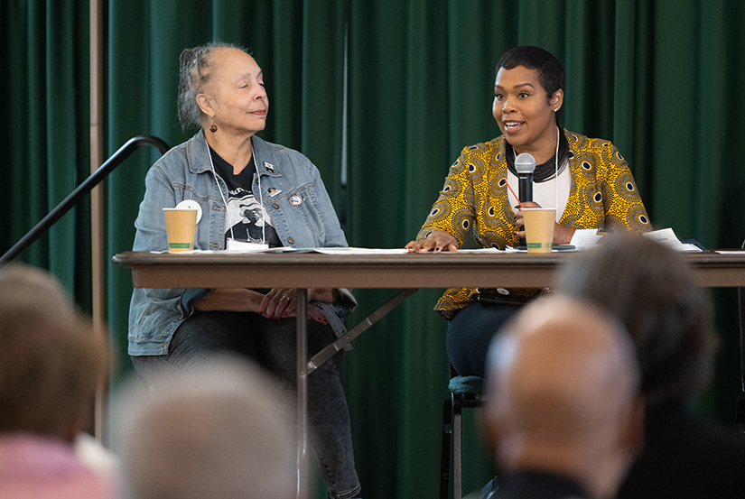Rashonda Alexander, right, a parishioner at St. Josephine Bakhita Parish in north St. Louis and descendant of enslaved people in St. Louis, spoke during the Catholic Religious Organizations Studying Slavery (CROSS) conference at the Cardinal Rigali Center. At left is Rita Montgomery Hollie, who attends St. Matthew the Apostle Church in north St. Louis and is on the advisory committee for the Jesuits’ Slavery, History, Memory and Reconciliation Project.