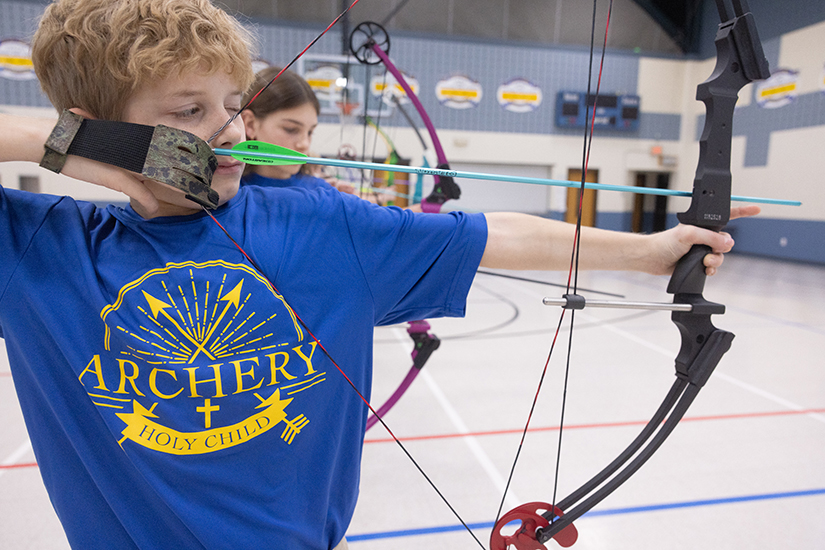 Holy Child sixth-grader John Hunze aimed an arrow at a target during archery team practice Jan. 10 at Holy Child School in Arnold. The archery team at the school was founded three years ago by volunteer coach Amanda Macke through the National Archery in the Schools Program.