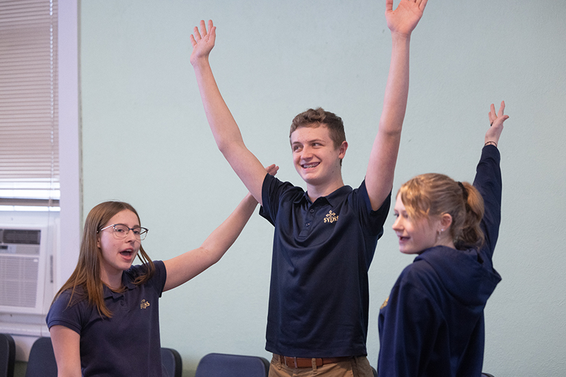 Noah Hager, center, a junior at St. Vincent de Paul High School, practiced for a school musical with junior Reese Zoellner, left, and sophomore Jocelyn Weibrecht on Jan. 25. Hager auditioned and was selected to perform with others at Carnegie Hall in New York City in February as part of the Honors Performance Series.