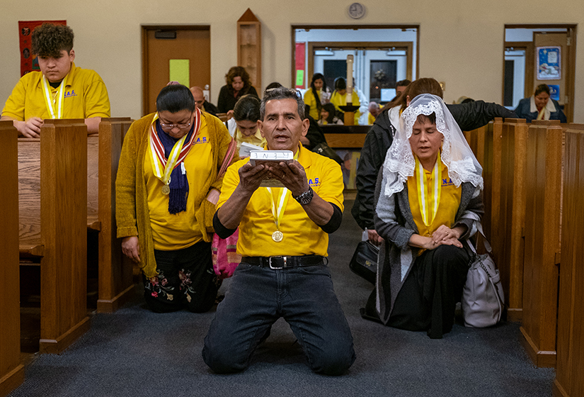 Group leader Rene Barahona led a procession of members of La Sociedad de Adoración Nocturna (Nocturnal Adoration Society) during a rotation of adorers as part of an overnight eucharistic adoration at Our Lady of Guadalupe Church in Ferguson on Feb. 3. Men, women and youth members take shifts throughout the night, concluding with a Rosary and Mass at 6 a.m.