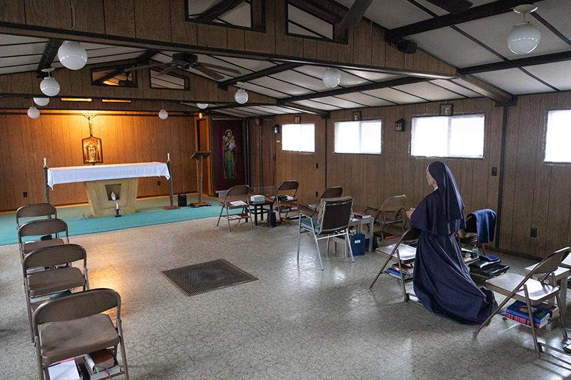 Sister Maria Felicity of the Daughters of Our Mother of Peace prayed in the Mary the Font Solitude chapel Feb. 12 in High Ridge. Members of the Society of Our Mother of Peace community spend several hours of the day in solitary prayer.