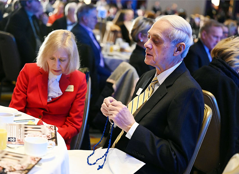 A man prayed with a rosary during the National Catholic Prayer Breakfast in Washington on Feb. 8.