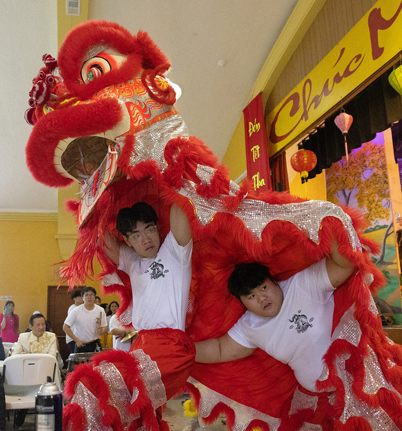 Nathan Tran and Vietnamese Eucharistic Youth Movement youth leader in training Steven Tran performed during a lion dance at a Lunar New Year celebration Feb. 11 at Resurrection of Our Lord Parish in south St. Louis.