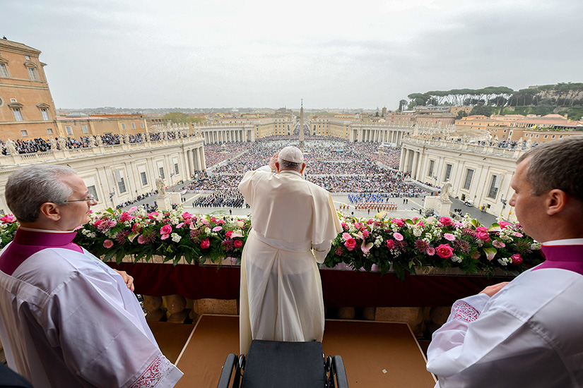 Pope Francis greeted the crowd after delivering his Easter message and blessing “urbi et orbi” (to the city and the world) from the central balcony of St. Peter’s Basilica at the Vatican March 31.
