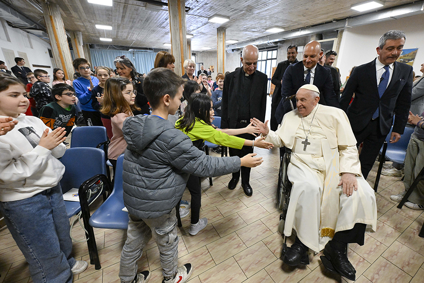 Pope Francis high-fives children at St. John Vianney Parish on the far eastern edge of Rome, which he visited April 11 to inaugurate his “School of Prayer” initiative in preparation for the Holy Year 2025. He spoke to the children about prayers of thanksgiving and answered their questions.