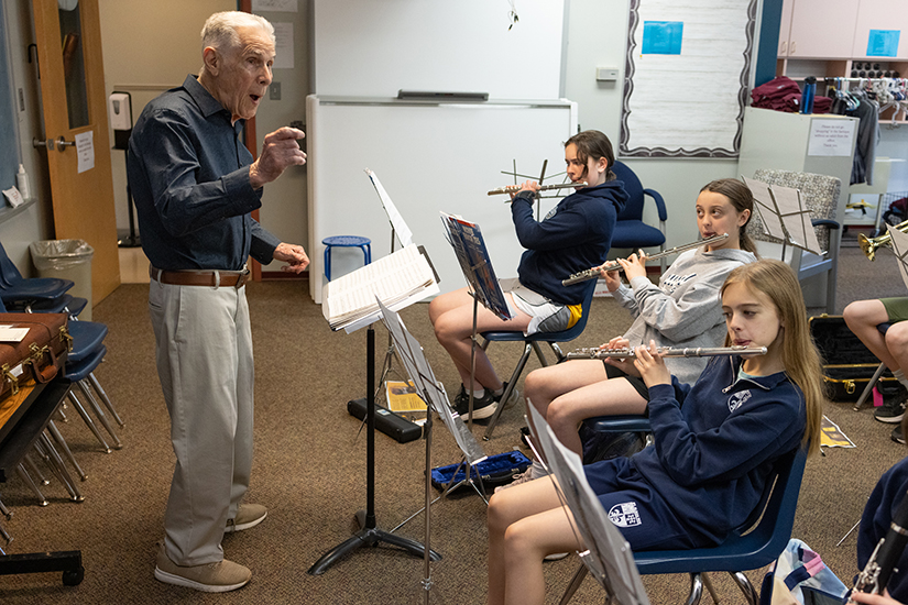 St. Alban Roe band teacher Joe Bozzi directed band members including Anya Hawley, Harper Keller and Amelia Joeckel during rehearsal April 17 at St. Alban Roe School in Wildwood. “I’ve just been doing it all my life,” the 89-year-old said about music. “I either teach or play, always.”