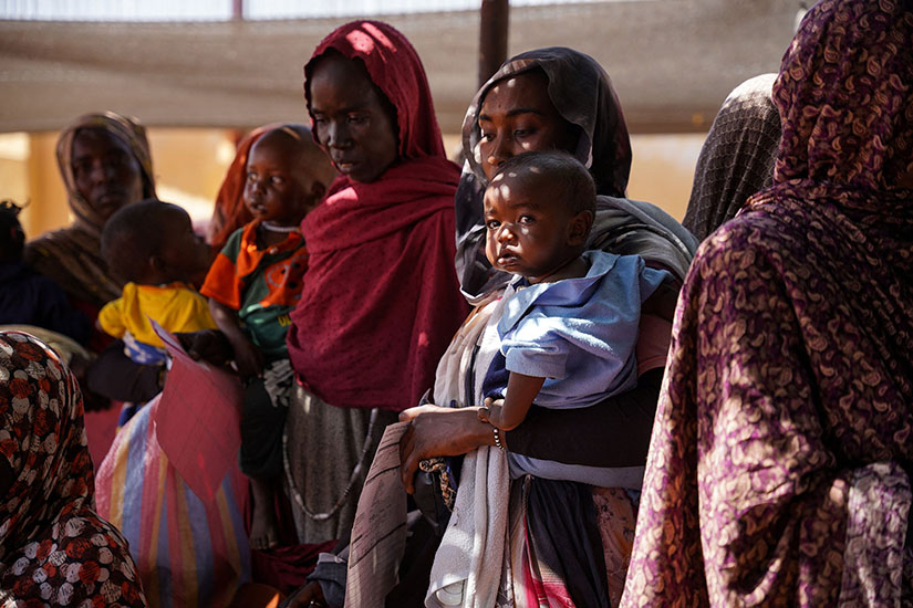 Women and children waited at the Zamzam displacement camp close to El Fasher in North Darfur, Sudan, in January.